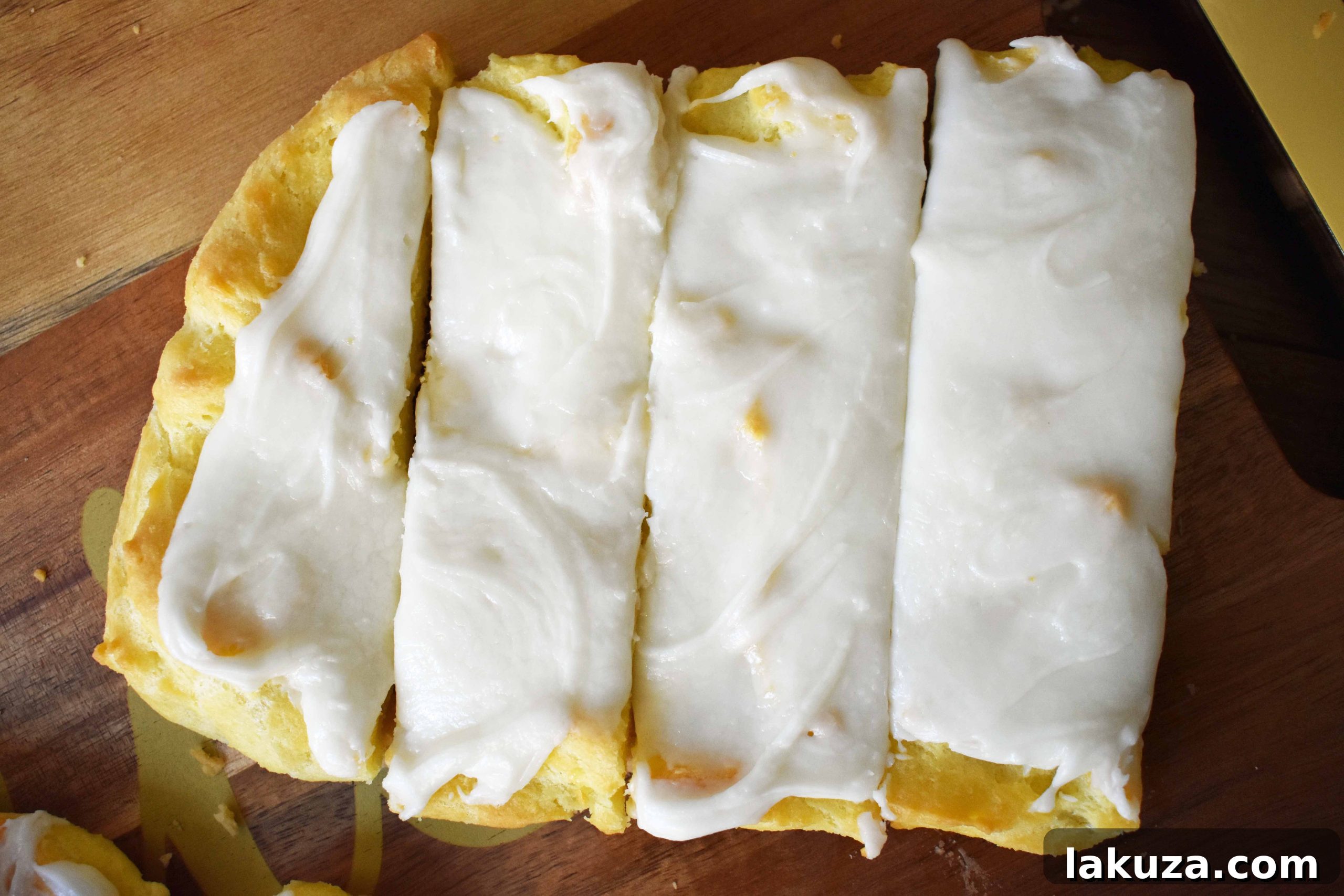 Swedish Pastry by Modern Honey. Buttery flaky layers with almond filling and topped with sweet cream frosting. A popular homemade European pastry. 