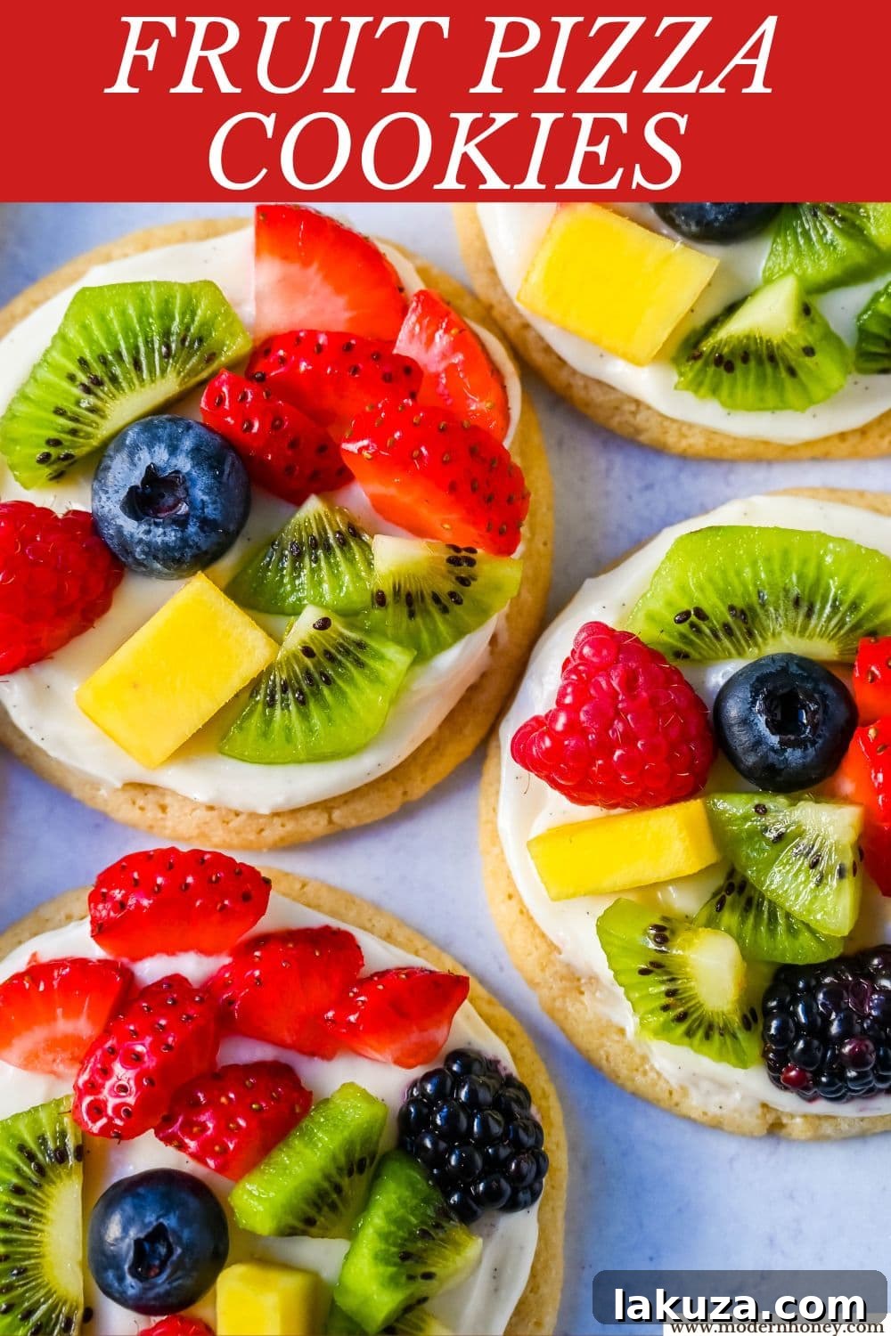 Close-up of a fruit pizza cookie with blueberries, strawberries, and kiwi, perfect for a party dessert.