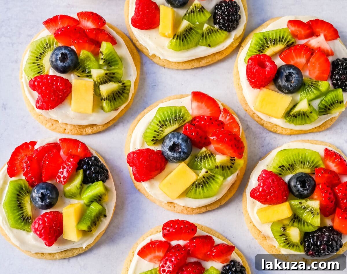 A beautifully decorated Fruit Pizza Cookie with fresh strawberries, blueberries, and kiwi, ready to be served.