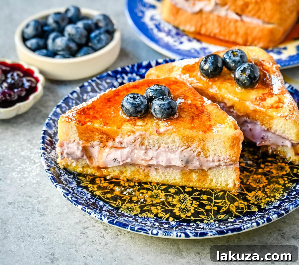 Decadent Blueberry Cheesecake French Toast 5 A perfectly cooked piece of Blueberry Cream Cheese Stuffed French Toast, golden and inviting.