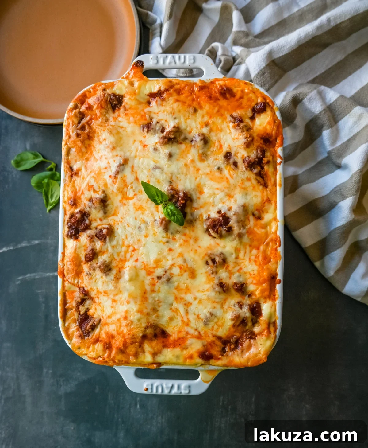 Close-up of creamy bechamel sauce in a pan, a key ingredient for the best lasagna recipe, showcasing its smooth texture.