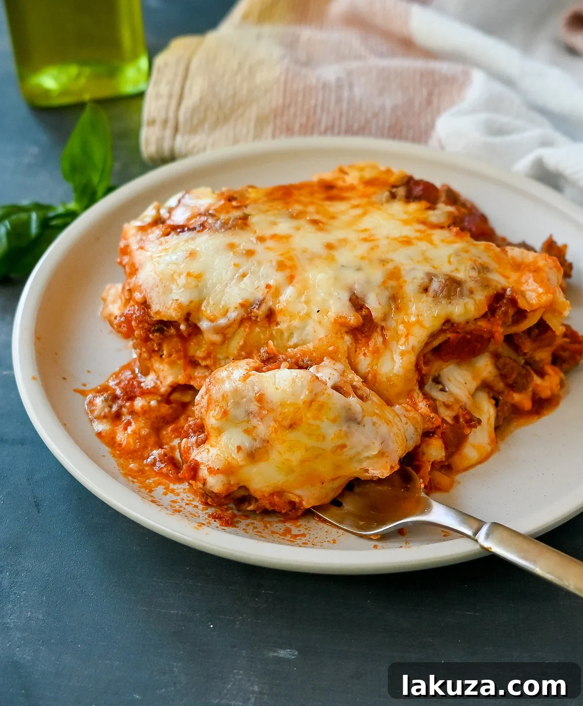Perfectly baked Italian Bolognese Lasagna, golden brown and bubbly, adorned with fresh basil, ready for serving.