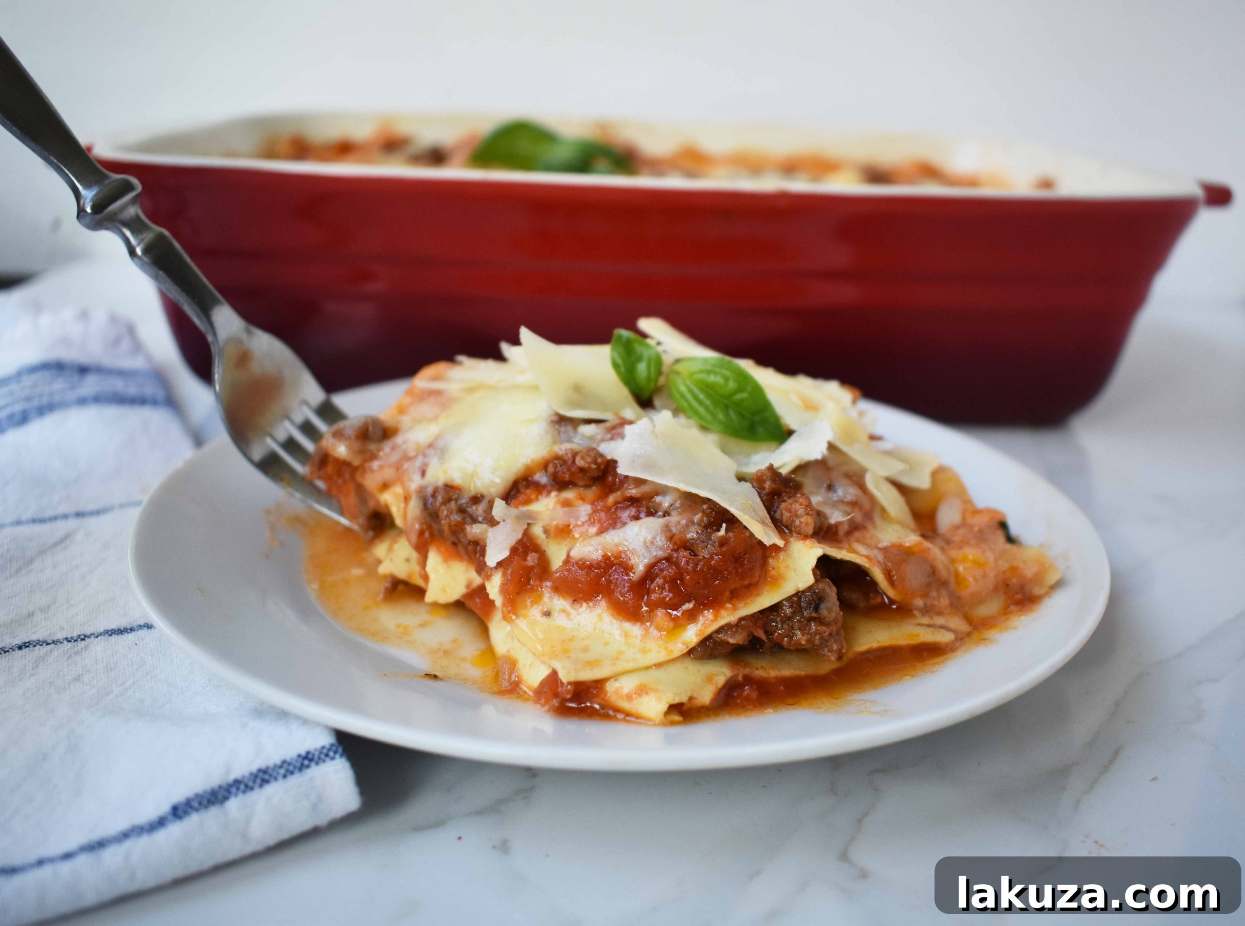 Authentic Italian Bolognese Lasagna, with rich meat sauce, creamy bechamel, and melted cheeses, served in a large baking dish, ready for sharing.