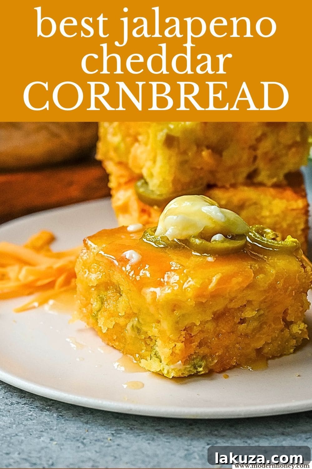 A stack of golden brown jalapeno cheddar cornbread slices, beautifully presented and ready to serve.