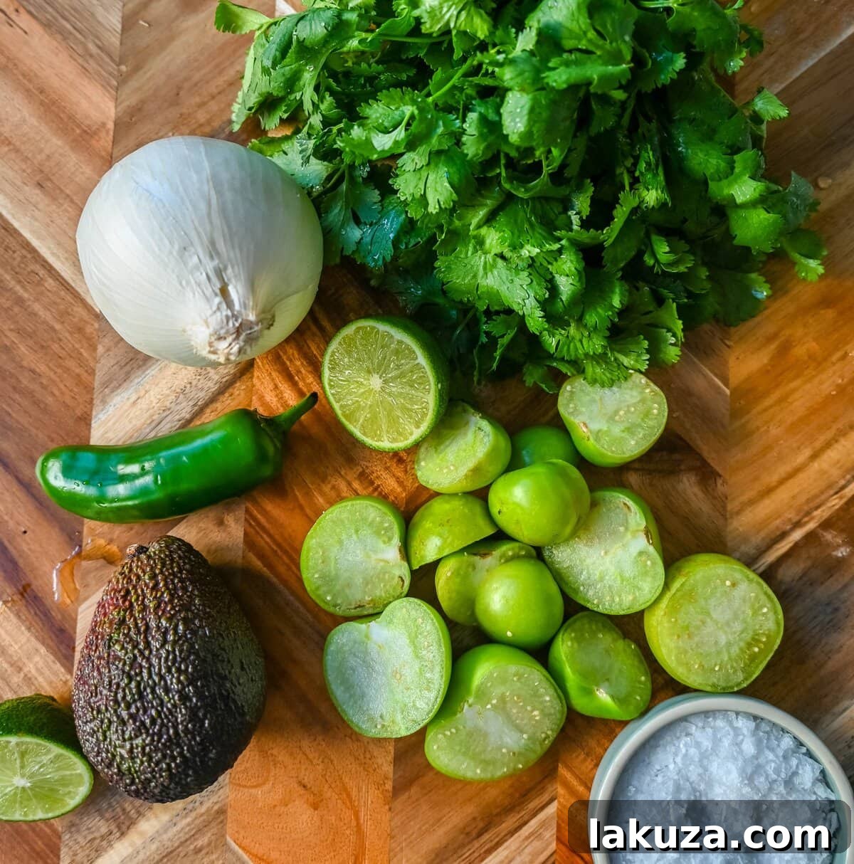 Essential ingredients for making homemade guacamole salsa.