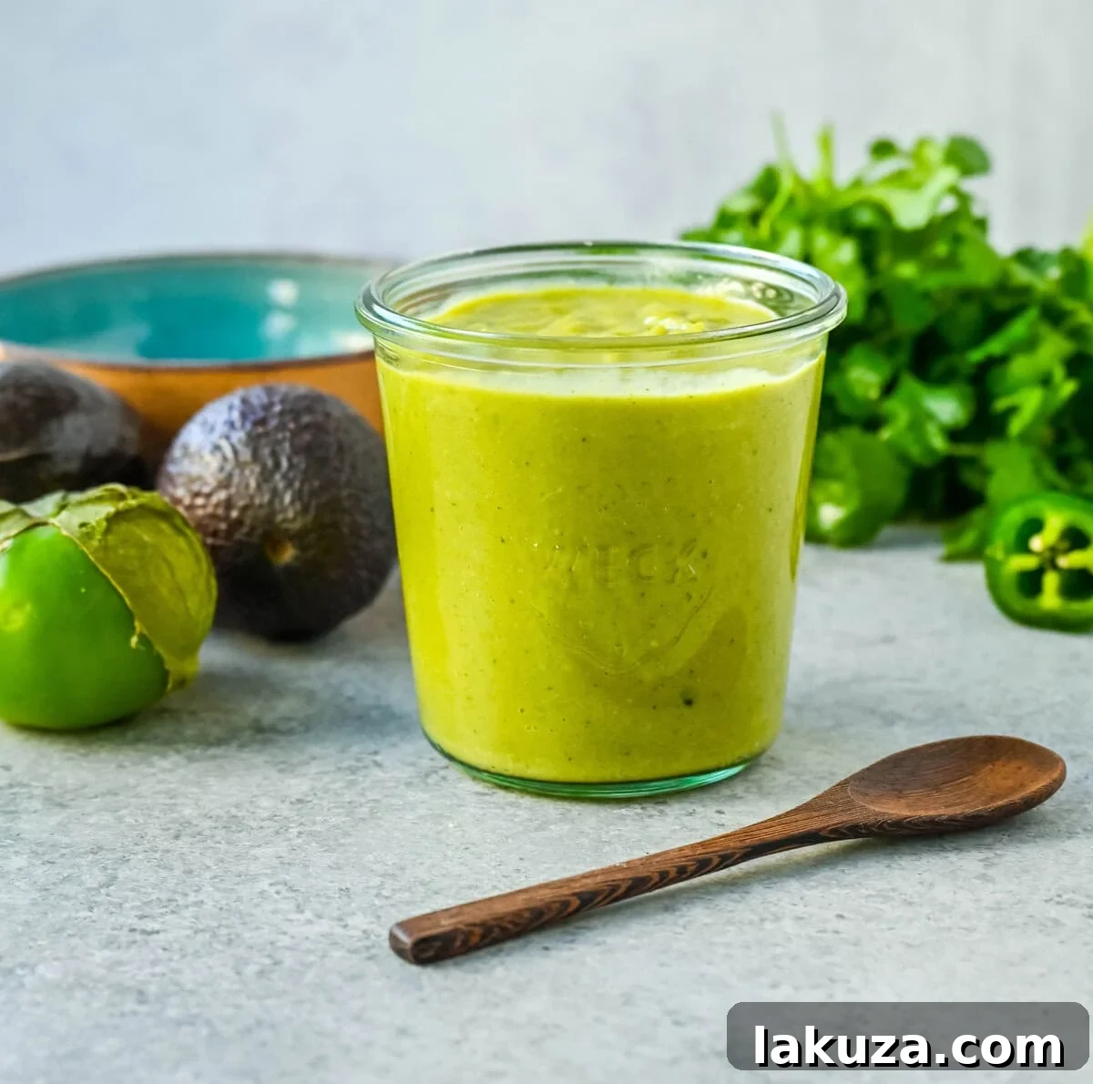Vibrant green creamy avocado salsa in a serving bowl.