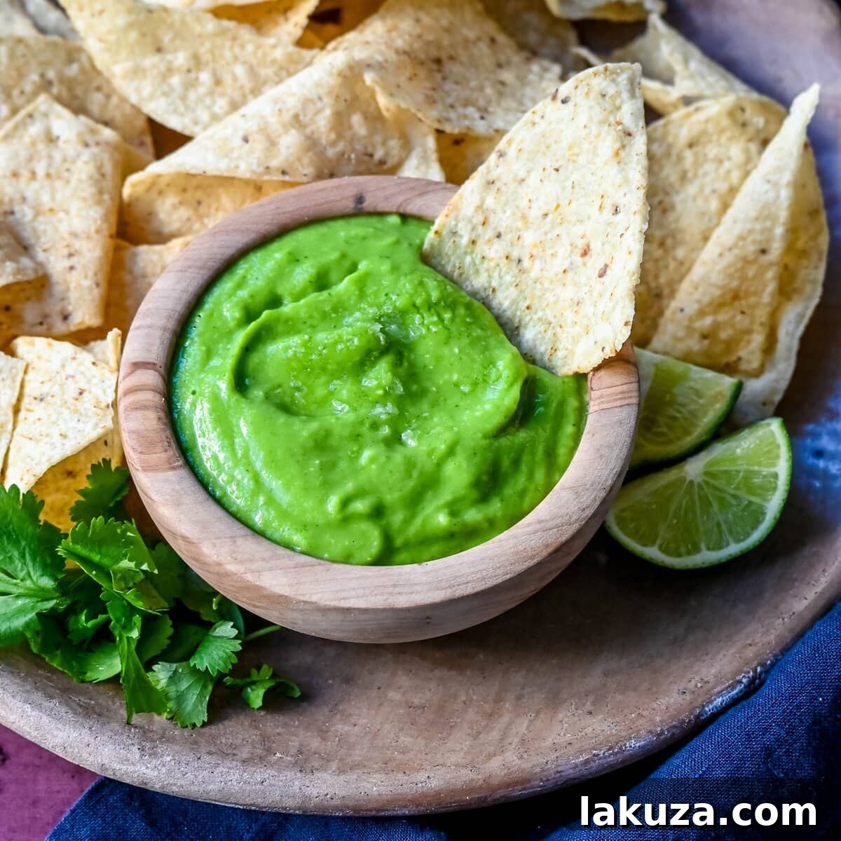 Delicious creamy avocado salsa served with tortilla chips.