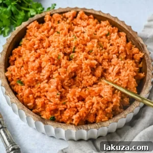This easy Spanish Rice Recipe — also known as Mexican rice — is a flavorful, vibrant side dish made with sautéed onions, long-grain rice, Mexican spices, and fresh tomato sauce. This is the best Spanish rice recipe and is so easy to make!