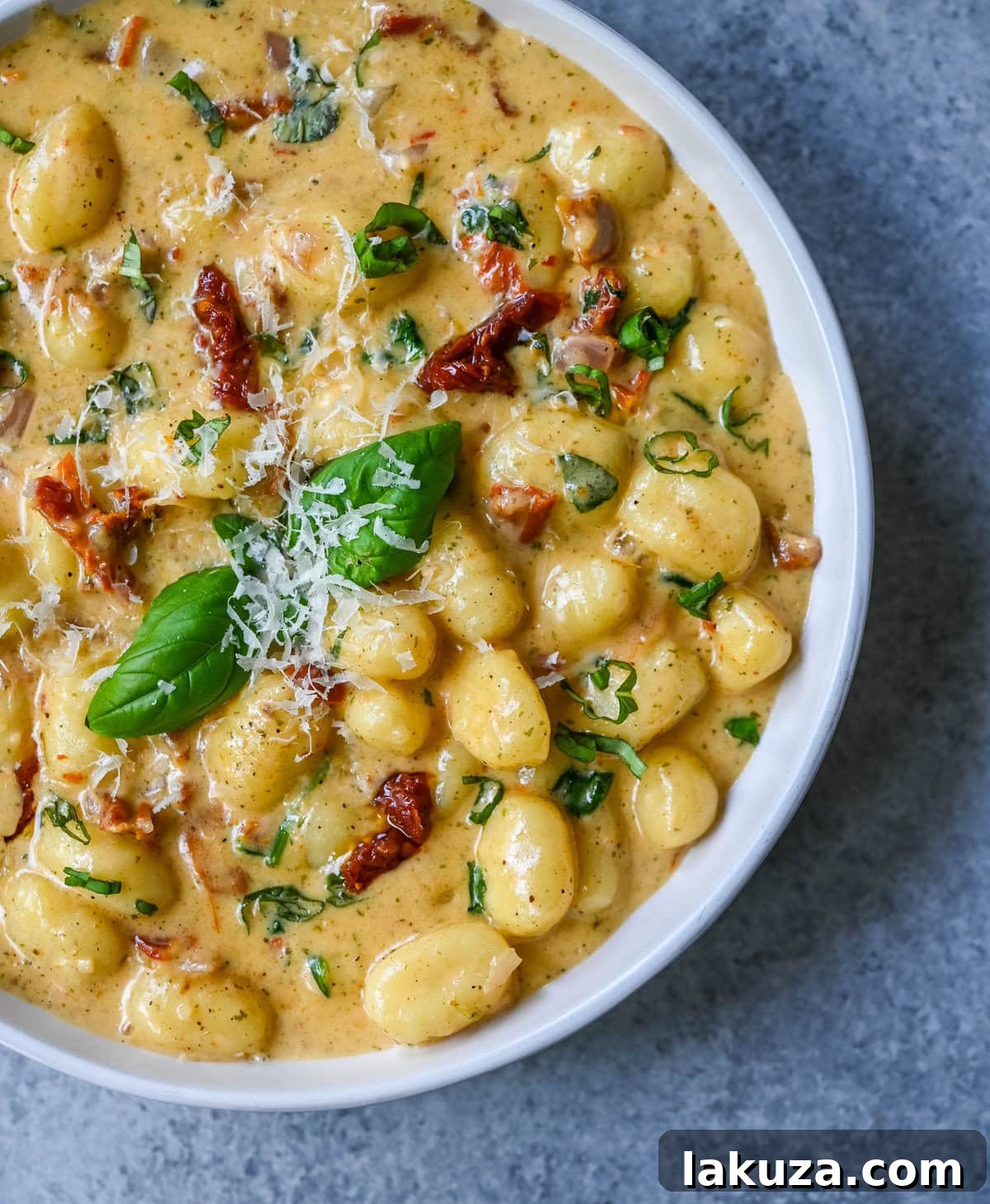 This easy Marry Me Gnocchi is made with pilowy gnocchi in a creamy sundried tomato cream sauce topped with fresh parmesan cheese and basil. Whip up this creamy Tuscan gnocchi with sun-dried tomatoes in one pan! Quick, easy, and bursting with flavor -- perfect for cozy dinners.