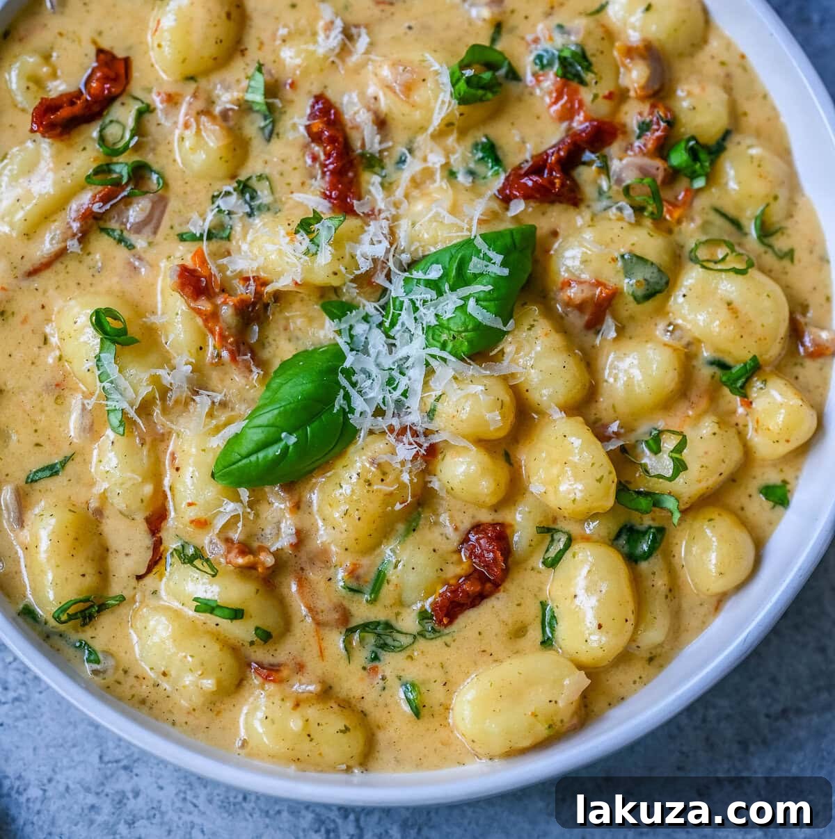 This easy Marry Me Gnocchi is made with pilowy gnocchi in a creamy sundried tomato cream sauce topped with fresh parmesan cheese and basil. Whip up this creamy Tuscan gnocchi with sun-dried tomatoes in one pan! Quick, easy, and bursting with flavor -- perfect for cozy dinners.