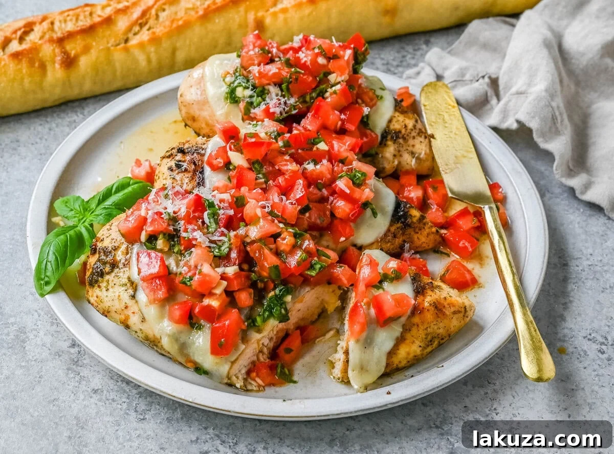 Fresh Bruschetta Chicken 5 Grilled Bruschetta Chicken served on a plate, garnished with fresh basil and a side of pasta.