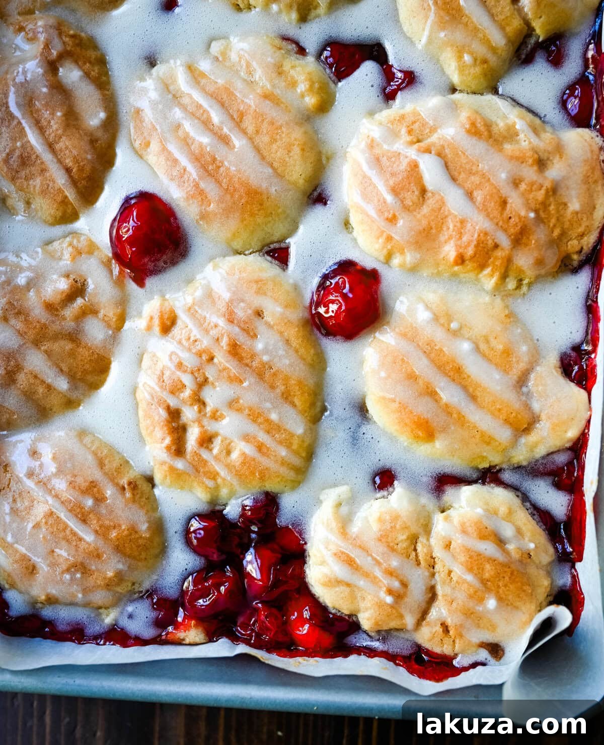Freshly baked Cherry Pie Cookie Bars, drizzled with icing and ready to be served.