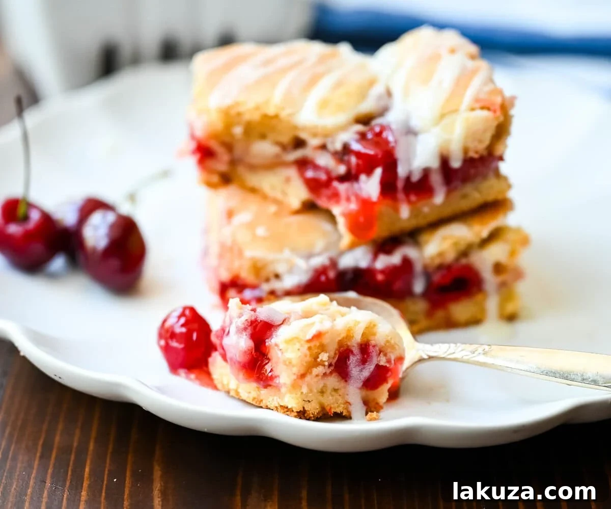 Beautifully arranged Cherry Pie Bars with a golden cookie crust, ready for serving.