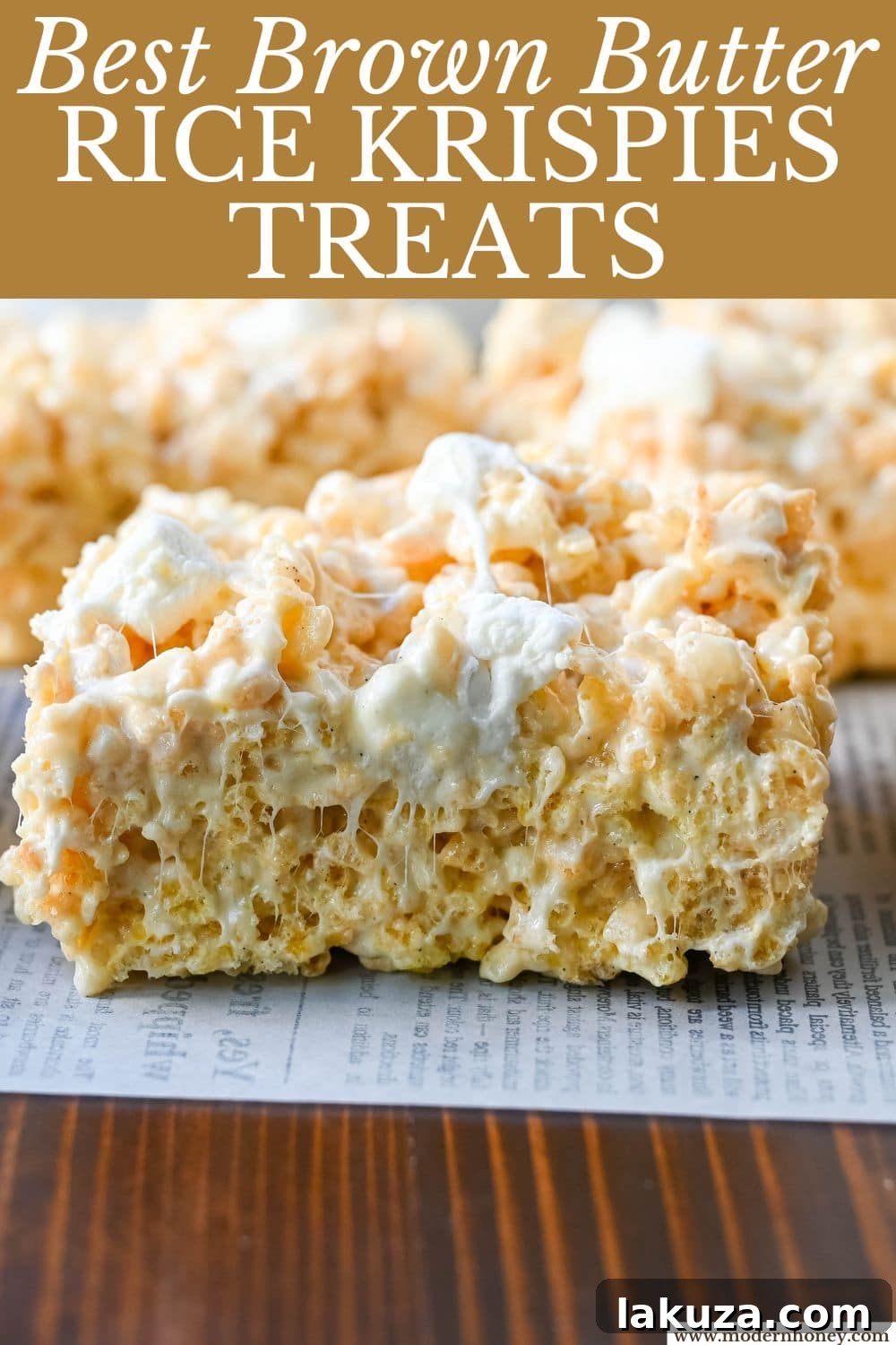 Nutty Brown Butter Crispy Bars 9 A stack of golden-brown Brown Butter Rice Krispies Treats, perfectly gooey and ready to eat, with a sprinkle of flaky sea salt.