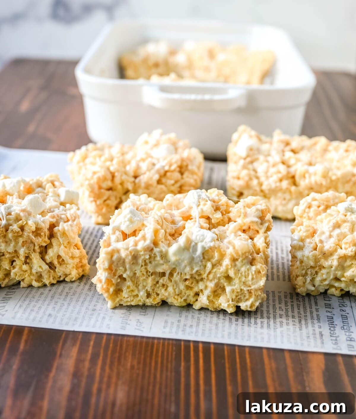 Nutty Brown Butter Crispy Bars 5 Step-by-step process of making Brown Butter Rice Krispies Treats: browning butter, melting marshmallows, adding cereal, and gently pressing into the pan for soft, chewy results.