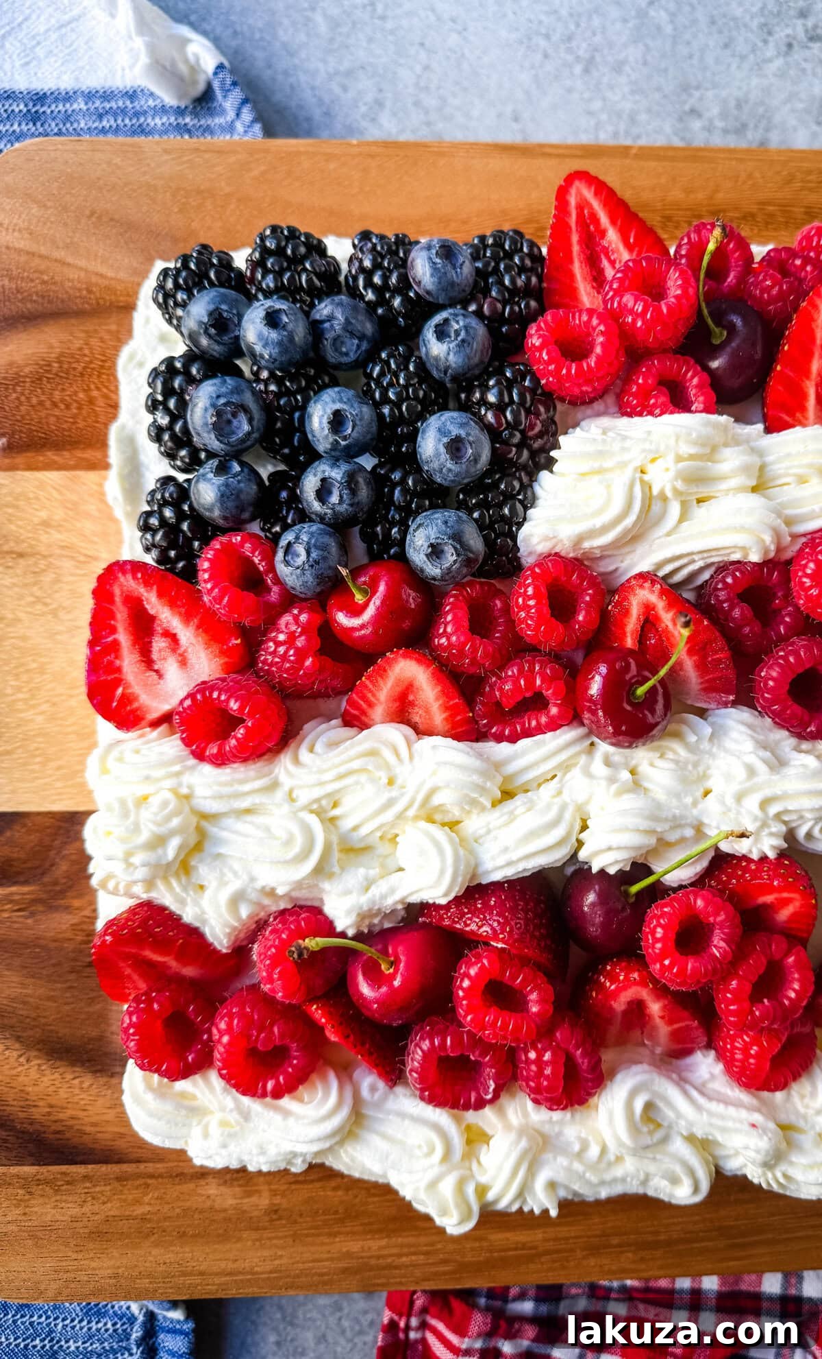 National Emblem Cake 3 Homemade Flag Cake with Fresh Berries. Perfect for 4th of July, Memorial Day, or any patriotic celebration.