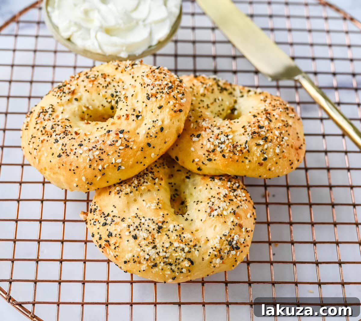Unbaked cottage cheese bagel dough shaped and ready for egg wash
