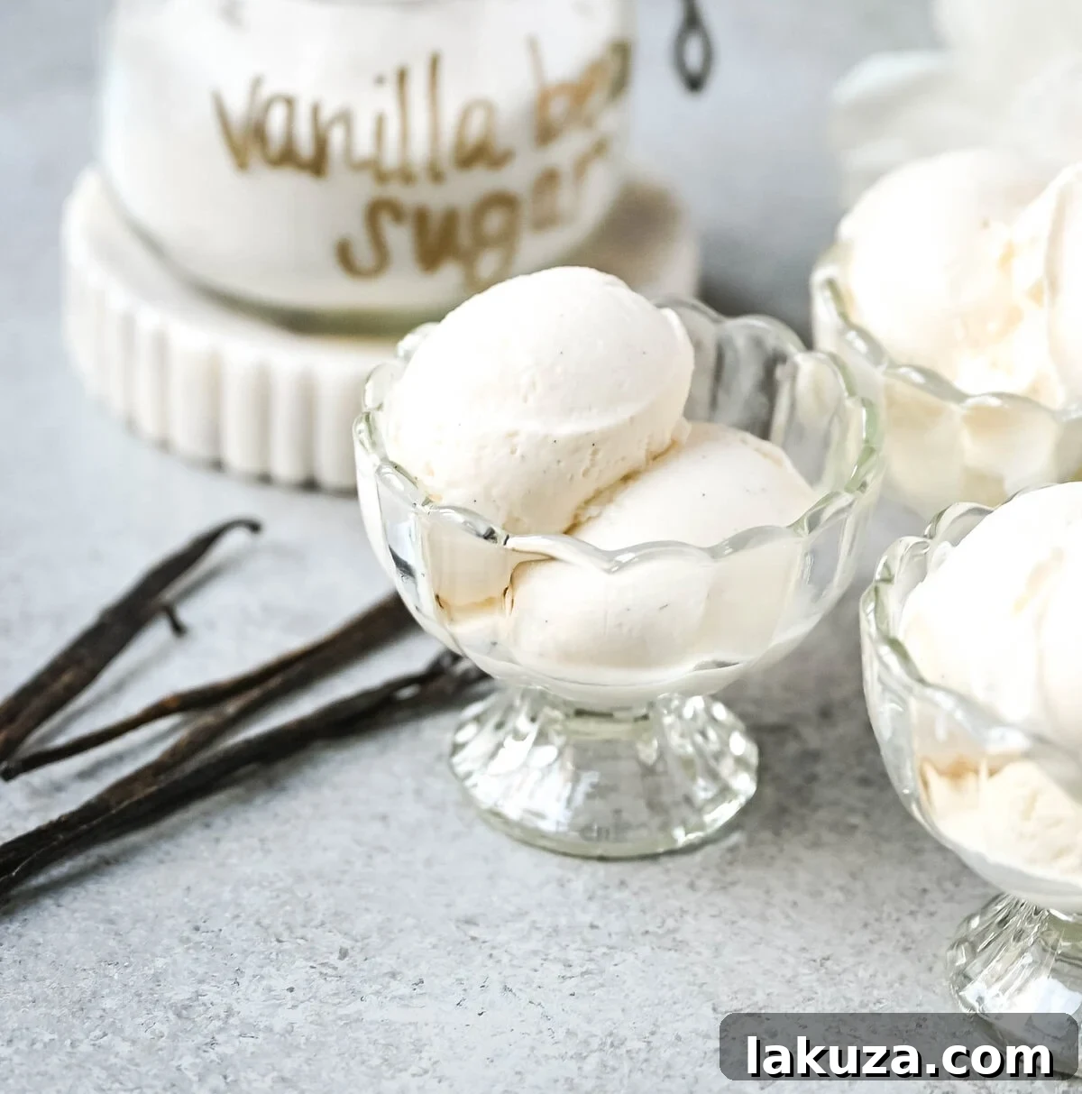 A scoop of homemade vanilla bean gelato, visibly rich and creamy, highlighting the tiny black flecks from the real vanilla bean pods.