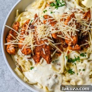 Cajun Chicken Alfredo is the ultimate comfort food with a spicy twist — tender blackened chicken, tossed in a silky Parmesan cream sauce over perfectly cooked pasta. Whether you're cooking for a weeknight dinner or a crowd, this dish delivers big time in flavor.
