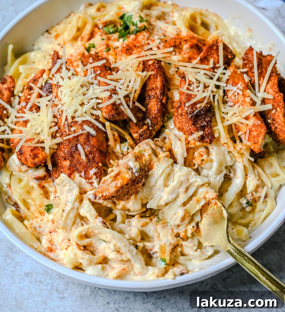 Creamy Cajun Chicken Alfredo 3 Cajun Chicken Alfredo is the ultimate comfort food with a spicy twist — tender blackened chicken, tossed in a silky Parmesan cream sauce over perfectly cooked pasta. Whether you're cooking for a weeknight dinner or a crowd, this dish delivers big time in flavor.