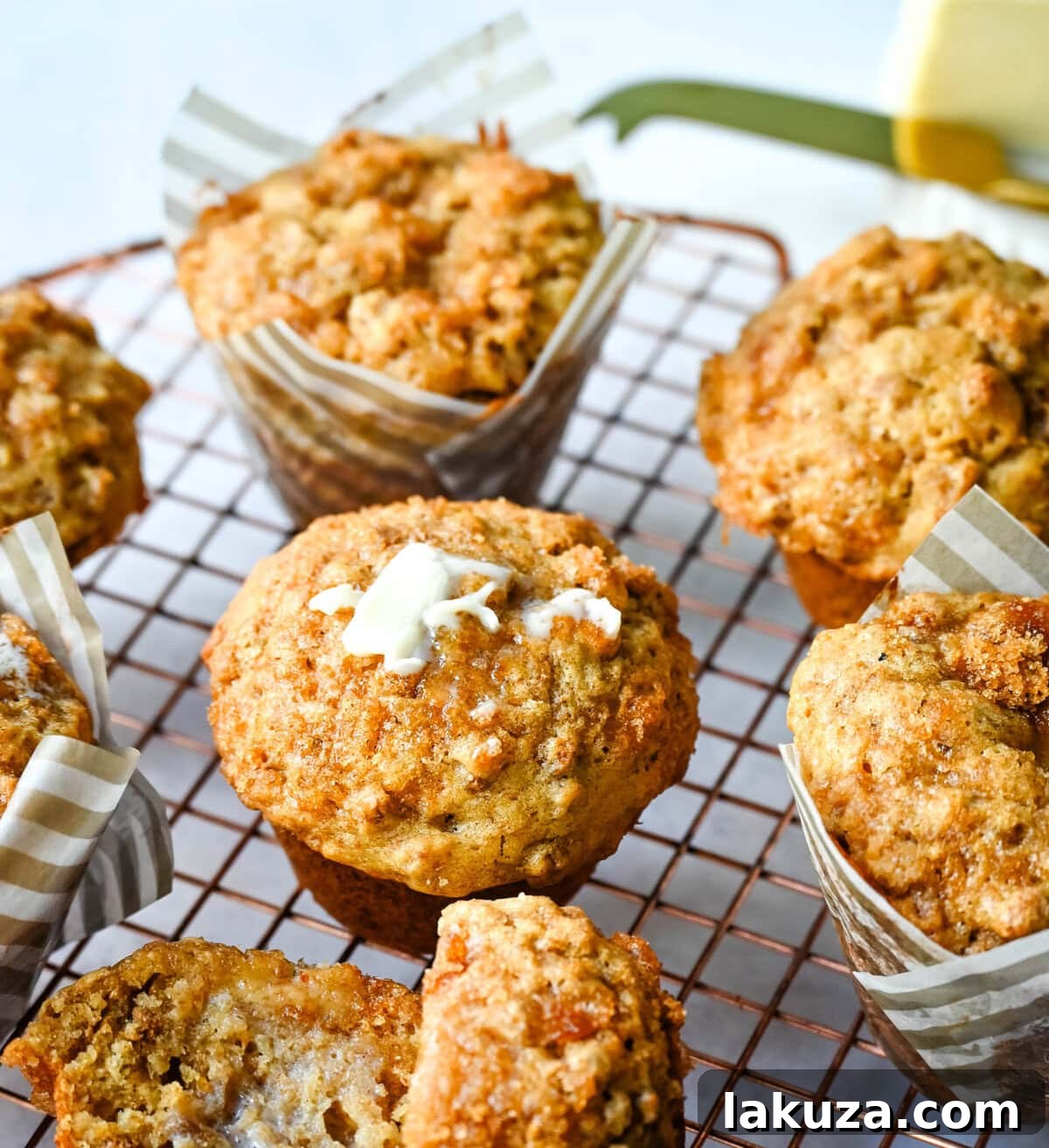 A batch of healthy, golden-brown bran muffins cooling on a rack, showcasing their fluffy texture