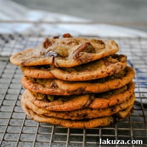 The Ultimate Thin and Chewy Chocolate Chip Cookies 8 A delicious thin and chewy chocolate chip cookie with perfectly melted chocolate, presented as the recipe card image for easy saving.