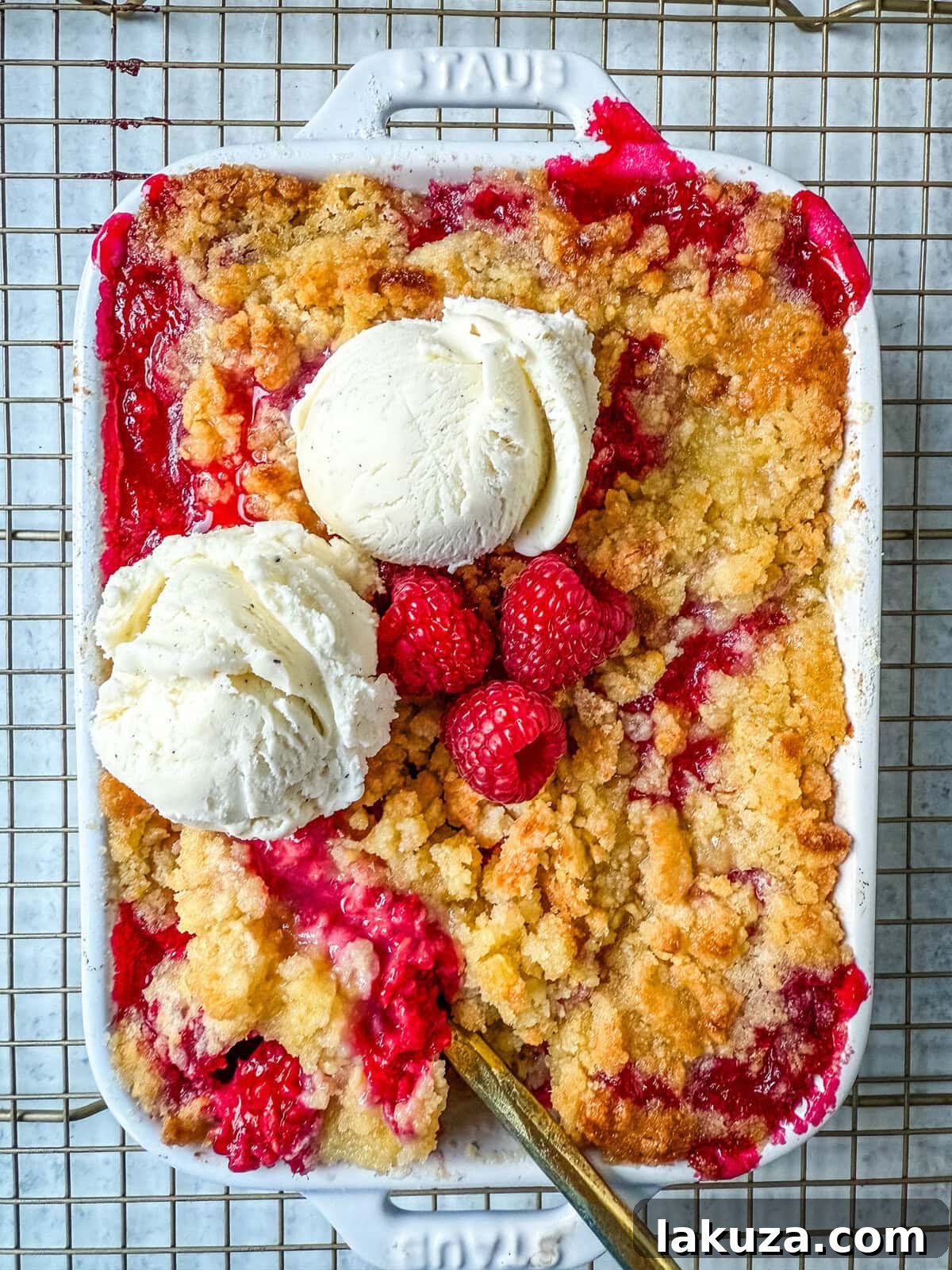 Golden Raspberry Delight 2 A warm, golden-brown raspberry crisp in a baking dish, ready to be served.