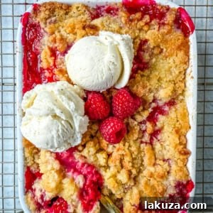 This easy Raspberry Crisp is a summer dessert favorite made with sweet, juicy raspberries and a buttery golden crumble topping.