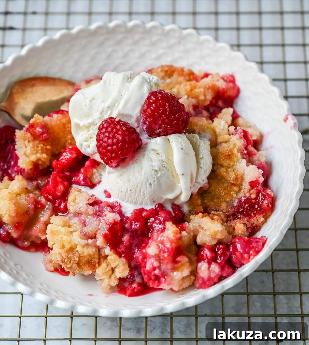 Golden Raspberry Delight 3 Close-up of a raspberry crisp showing the juicy raspberry filling and crumbly topping.