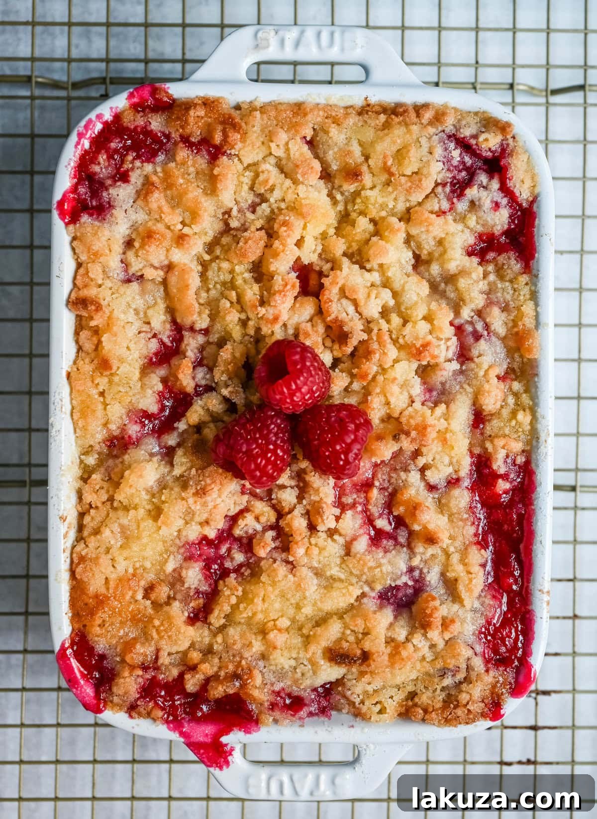 Golden Raspberry Delight 4 Raspberry crisp baking in a cast iron skillet, bubbling at the edges.