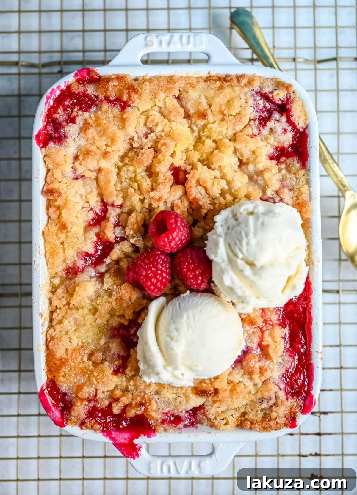 Golden Raspberry Delight 6 A scoop of vanilla ice cream melting over warm raspberry crisp.