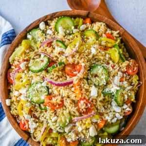 Fresh Mediterranean Orzo Salad made with a bright greek oregano dressing, orzo pasta, crisp cucumber, cherry tomatoes, red onion, feta cheese, and pepperoncinis. This greek orzo pasta salad recipe is perfect for summer or meal prep!