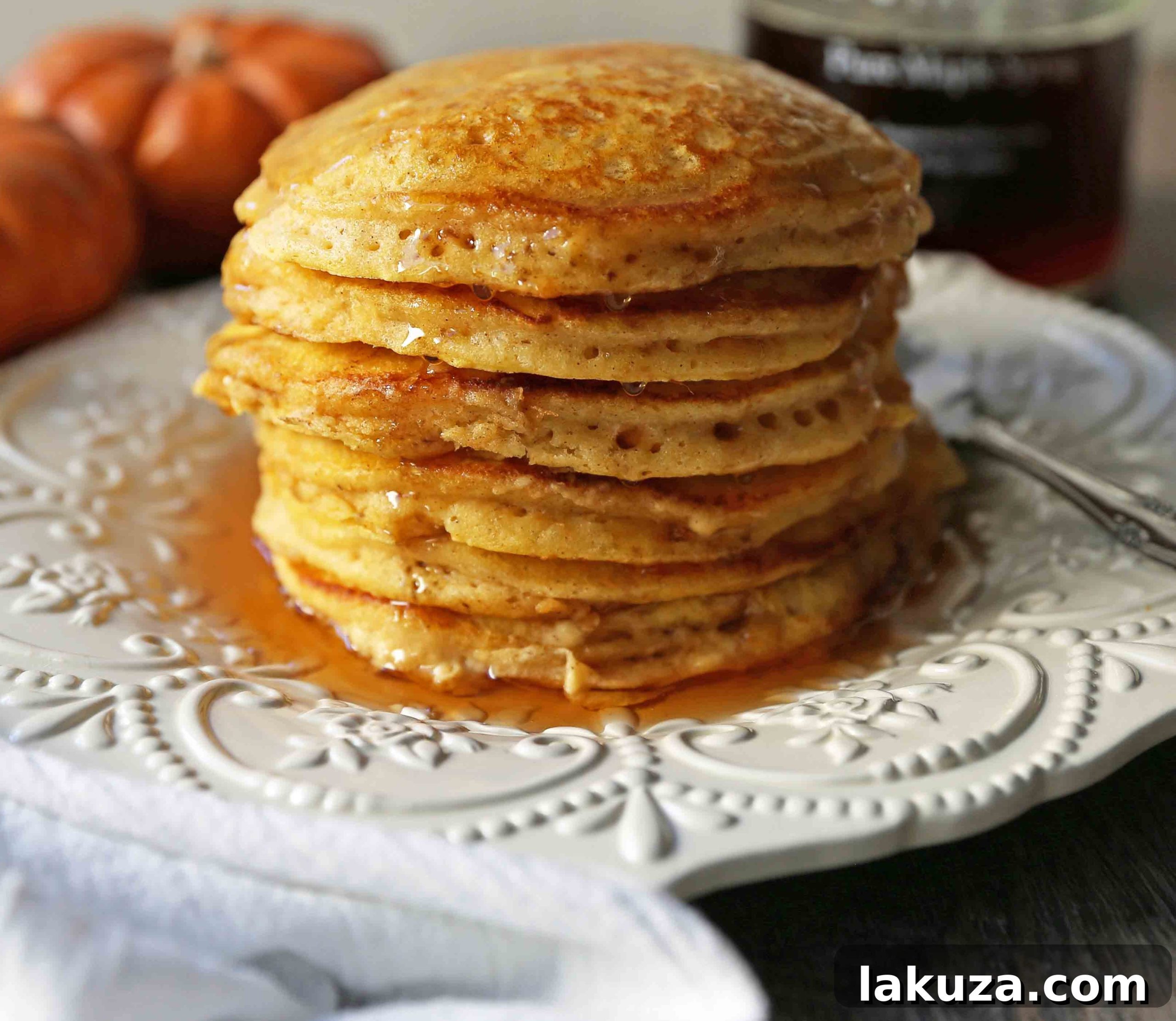 The BEST Pumpkin Pancakes. Light, fluffy, airy, and creamy pumpkin spiced pancakes. The perfect Fall breakfast. www.modernhoney.com #pumpkin #pumpkinpancakes #pumpkinrecipes #pumpkinbreakfast #fallbreakfast #pumpkinspice