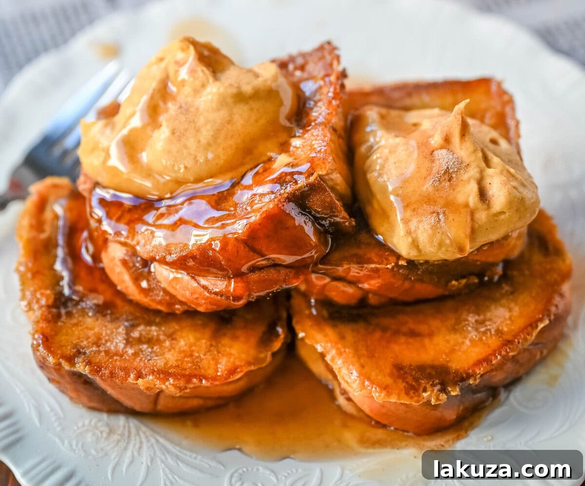 This Pumpkin French Toast is the perfect fall breakfast! Made with pumpkin puree, pumpkin spice, and thick slices of brioche cinnamon bread, it’s golden on the outside, soft inside, and topped with a dollop of sweet brown sugar pumpkin spice cream cheese.