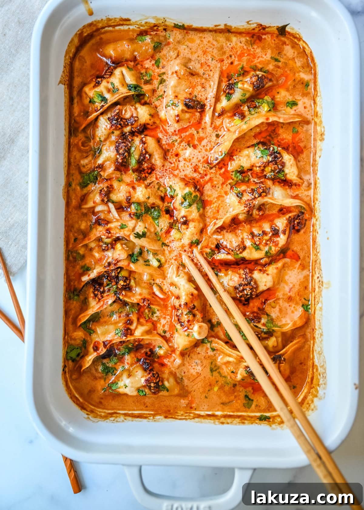Golden Baked Dumplings 5 These viral baked dumplings from TikTok are the ultimate easy dinner hack! Crispy dumplings are baked in a creamy coconut curry sauce and topped with cilantro, chili crunch oil, and sesame seeds for the perfect mix of flavor and texture. This is an easy sheet pan dinner recipe!