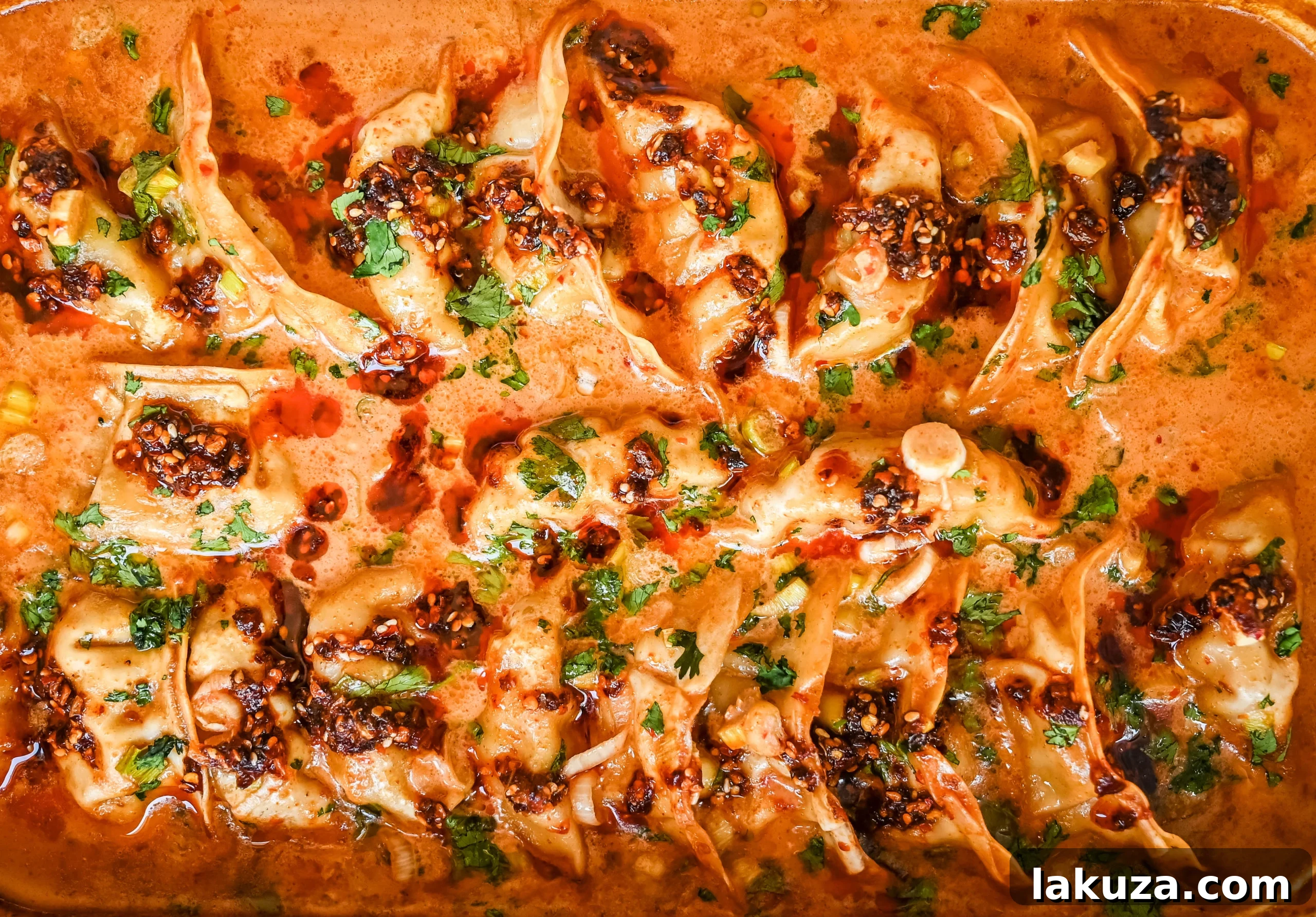 Golden Baked Dumplings 6 These viral baked dumplings from TikTok are the ultimate easy dinner hack! Crispy dumplings are baked in a creamy coconut curry sauce and topped with cilantro, chili crunch oil, and sesame seeds for the perfect mix of flavor and texture. This is an easy sheet pan dinner recipe!