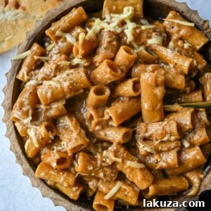 This One Pot French Onion Pasta takes everything you love about French onion soup and turns it into a creamy and cheesy pasta dish. This popular dinner recipe on TikTok is made in just one pot, with caramelized onions, garlic, thyme, and pasta simmered in a savory creamy broth, then topped with Gruyère and Parmesan cheese. 
