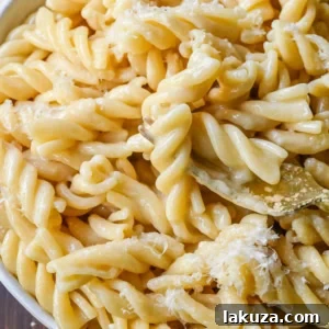 The World's Best Buttered Noodles: A classic Burro e Parmigiano made with tender pasta, rich butter, and grated Parmesan cheese.
