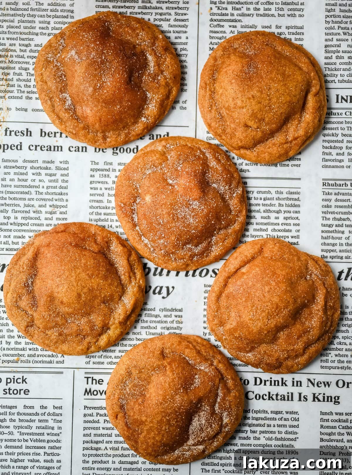 Stack of pumpkin cheesecake cookies dusted with cinnamon sugar, ready to be enjoyed.