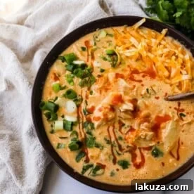 This Creamy Buffalo Chicken Chili is the perfect twist on a white chicken chili recipe. It is perfectly spiced, creamy, and has the right amount of tang. This will be your new favorite Buffalo white chicken chili recipe!