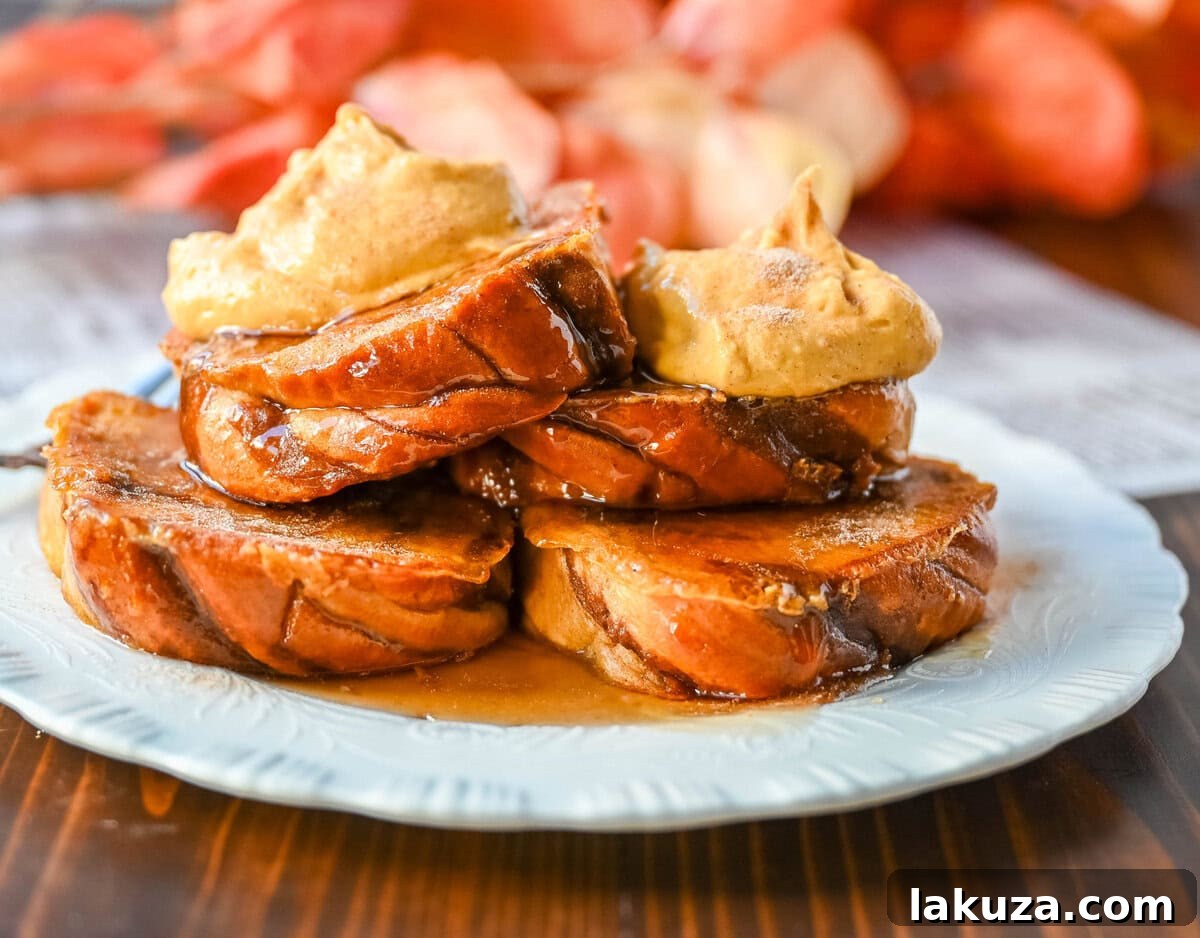 Perfectly golden Pumpkin French Toast slices served with creamy topping and maple syrup.