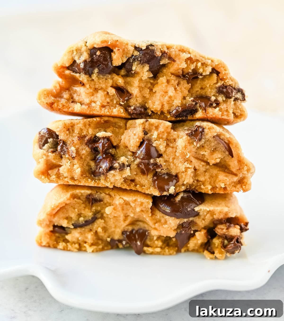Rich, thick, and soft, these peanut butter chocolate chip cookies taste just like Levain Bakery but made at home. These Levain Bakery Peanut Butter Dark Chocolate Chip cookies are the perfect soft peanut butter chocolate chunk cookie!