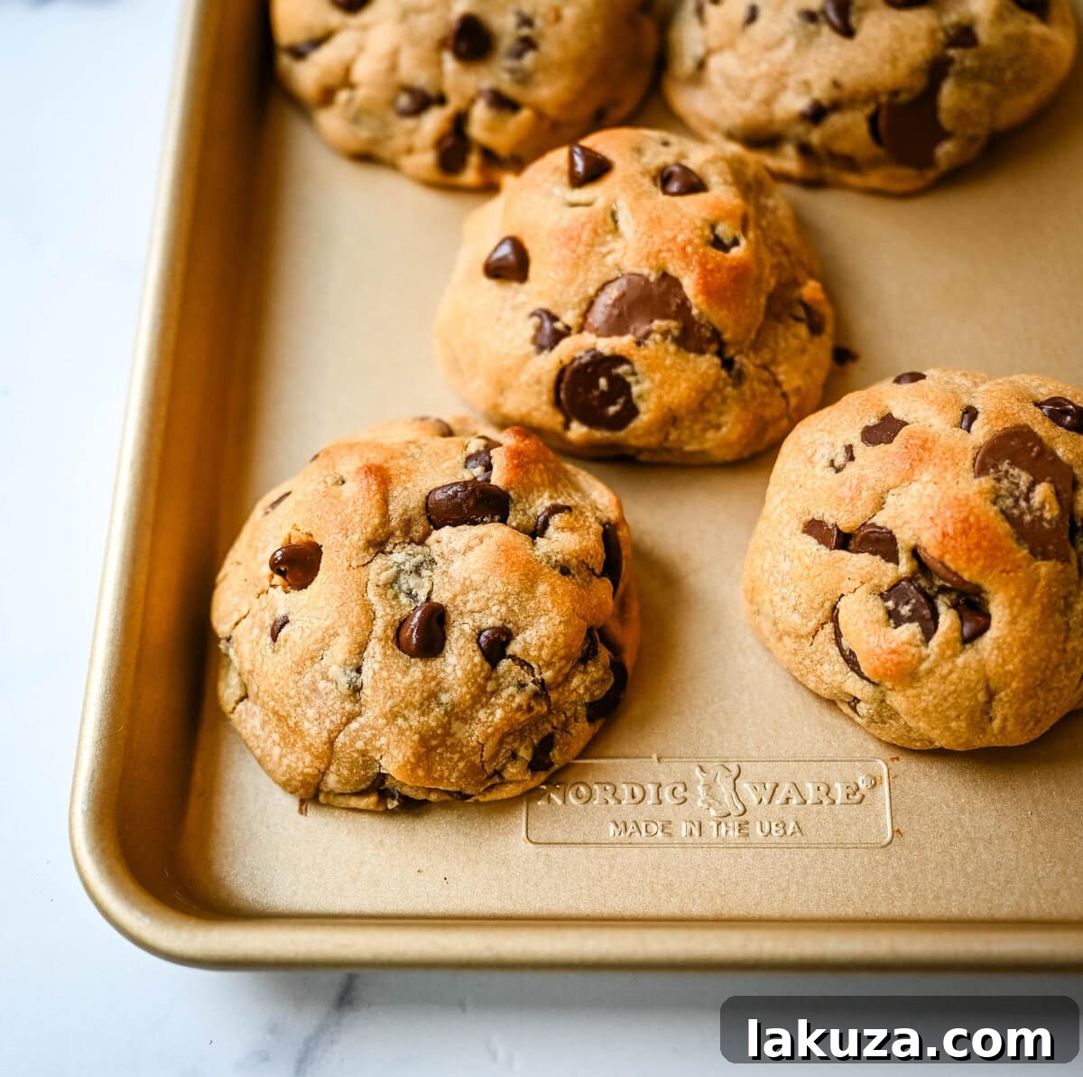 Rich, thick, and soft, these peanut butter chocolate chip cookies taste just like Levain Bakery but made at home. These Levain Bakery Peanut Butter Dark Chocolate Chip cookies are the perfect soft peanut butter chocolate chunk cookie!