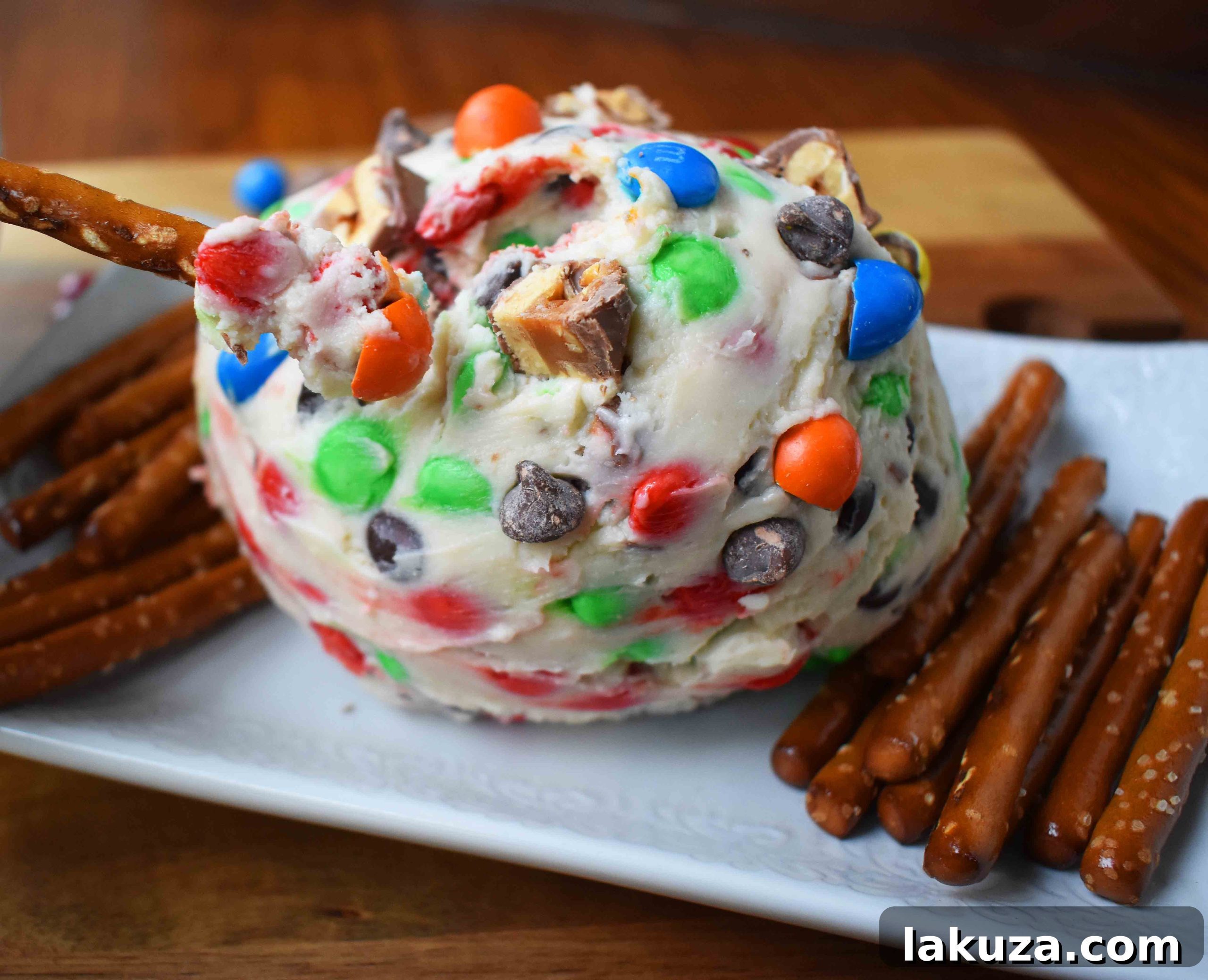 Decadent Candy Bar Cheeseball 2 Delicious Chocolate Candy Bar Cheese Ball, a perfect sweet party dessert. Serve with pretzels for a delightful sweet and salty combination.
