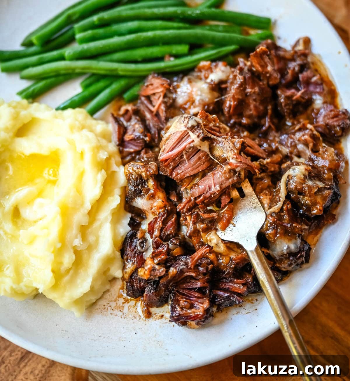 Slow-Cooked French Onion Beef Pot Roast 2 Delicious French Onion Pot Roast in a slow cooker, ready to serve.