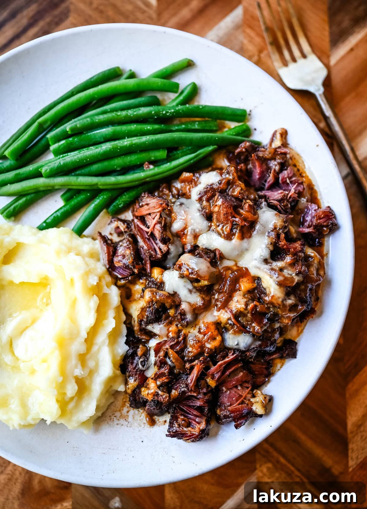 Slow-Cooked French Onion Beef Pot Roast 5 Generous serving of French Onion Pot Roast with creamy mashed potatoes.