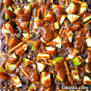 Harvest Spice Caramel Apple Bark 9 Caramel Apple Bark: An easy no-bake Fall treat with fresh apples, buttery caramel, crunchy pretzels, and rich chocolate.
