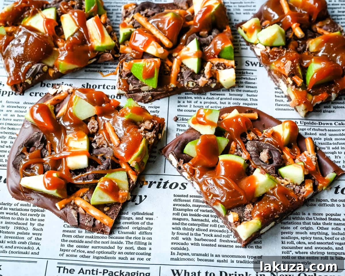 Harvest Spice Caramel Apple Bark 3 Close-up of freshly made Caramel Apple Bark, showing layers of chocolate, pretzels, diced green apples, and caramel drizzle, ready to be chilled.