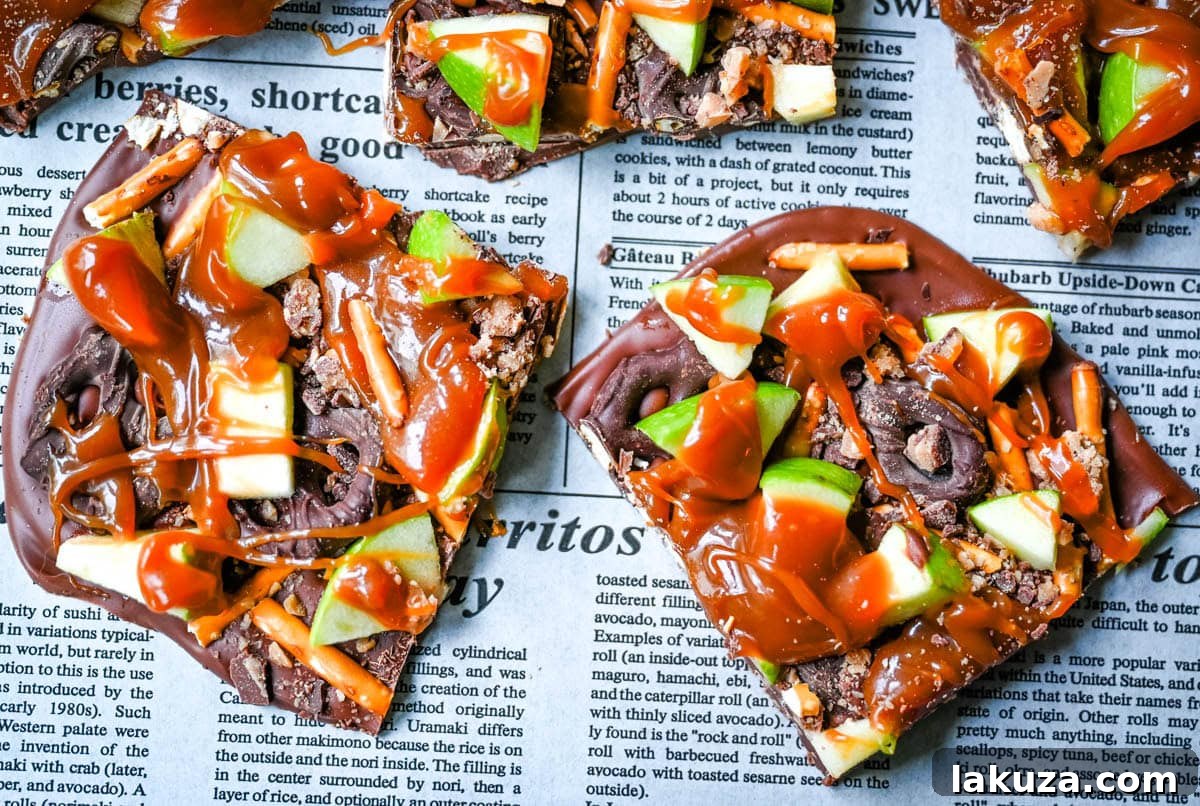 Harvest Spice Caramel Apple Bark 6 Hand reaching for a piece of Caramel Apple Bark, highlighting its irresistible appeal as a ready-to-eat Fall dessert.