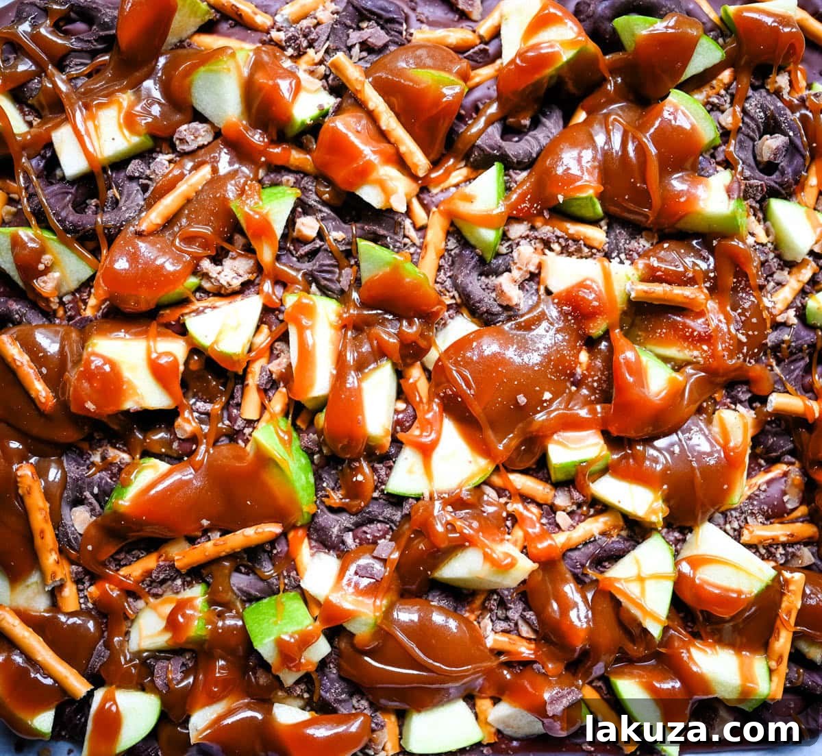 Harvest Spice Caramel Apple Bark 7 A vibrant display of Caramel Apple Bark pieces on a serving platter, perfect for sharing at any Fall gathering.